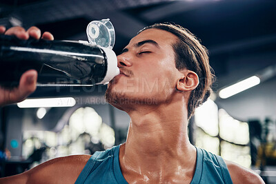 Buy stock photo Man, drinking water and training exercise in sports gym for healthy lifestyle. Tired athlete, fitness workout and wellness motivation or bodybuilder cardio rest and water hydration in health club