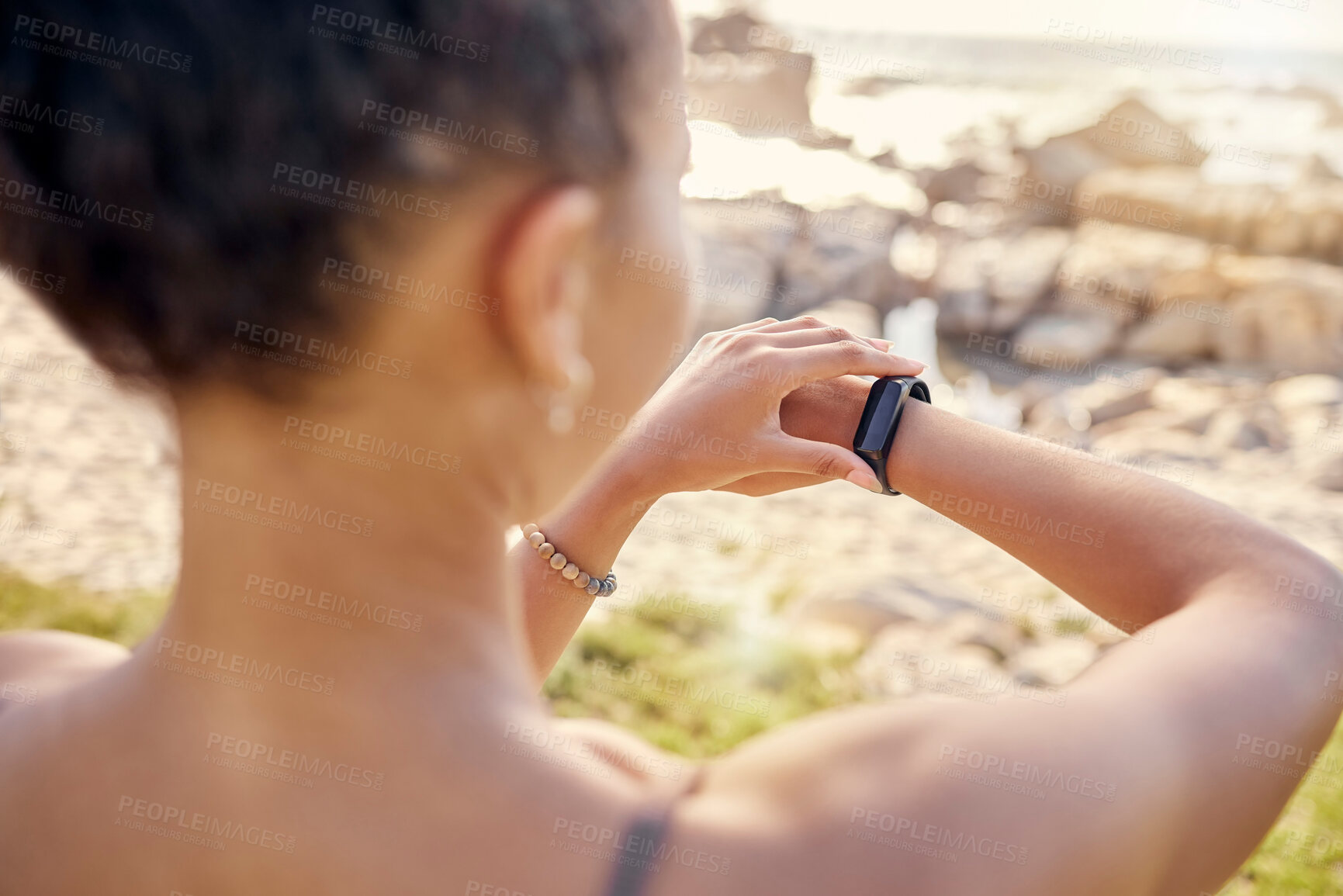 Buy stock photo Fitness, smartwatch and time, cardio and woman at beach for exercise and sport technology for training outdoor. Workout, nature and athlete check watch, sports motivation and endurance on the coast.