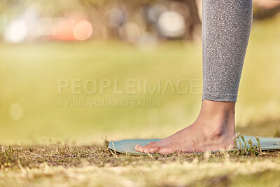 Buy stock photo Woman feet, mat and yoga on grass, park and exercise, meditation and spiritual wellness in nature for zen. Female, pilates or cardio person with workout training for peace, calm and healthy lifestyle