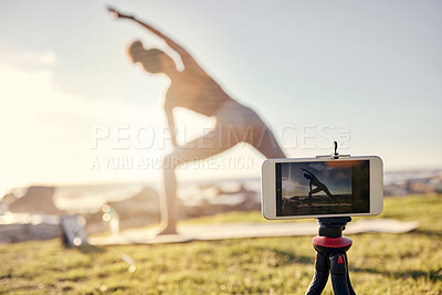 Buy stock photo Fitness, woman and yoga live stream with phone stand for social media, vlogger or exercise tutorial in nature. Female in spiritual, zen and wellness training recording sports workout on smartphone
