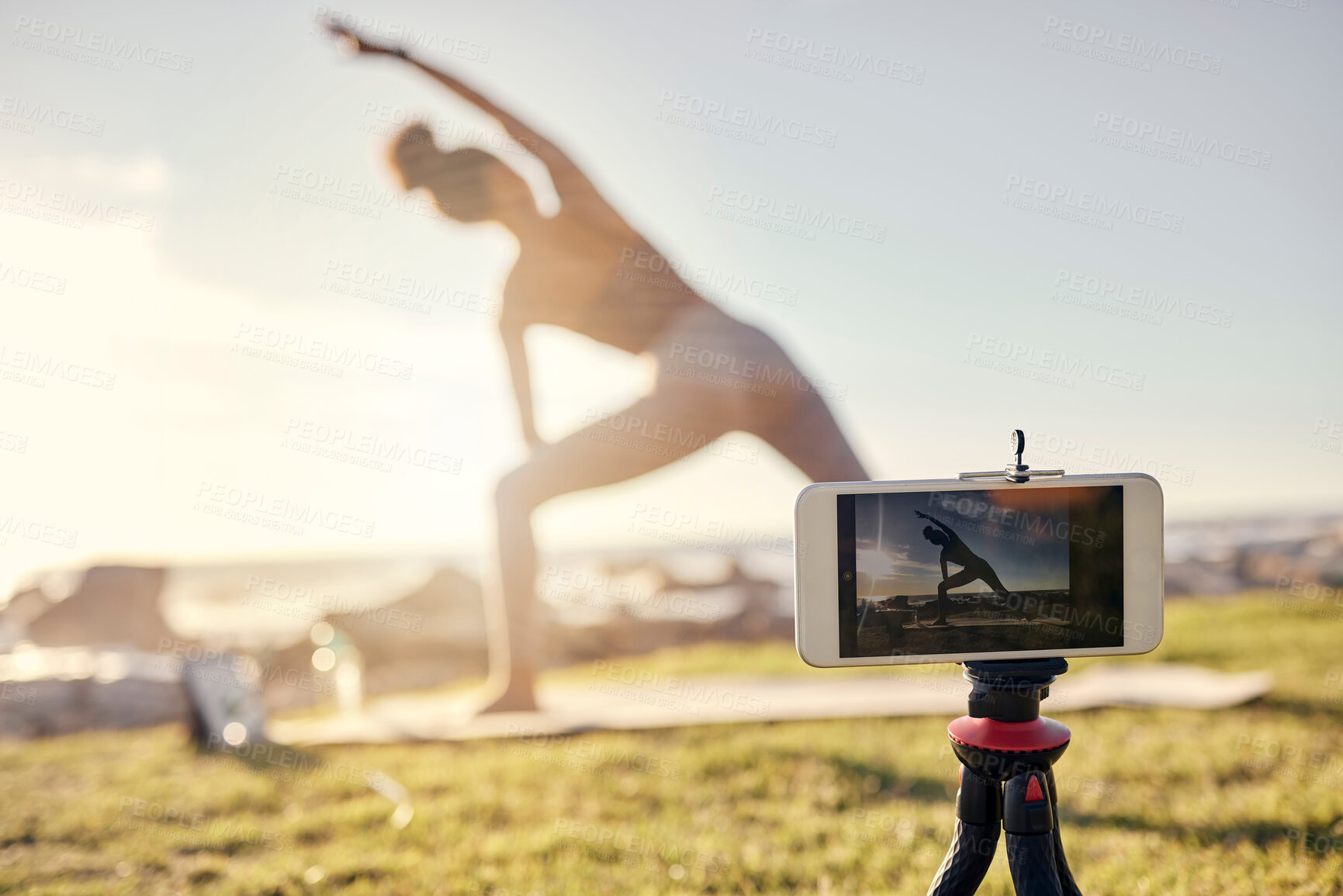 Buy stock photo Fitness, woman and yoga live stream with phone stand for social media, vlogger or exercise tutorial in nature. Female in spiritual, zen and wellness training recording sports workout on smartphone