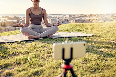 Buy stock photo Yoga, meditation and live streaming woman in nature on smartphone for peace, healing and mindfulness content creation on social media. Influencer or fitness content creator meditate outdoor on video
