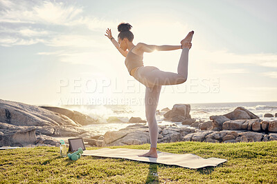 Buy stock photo Yoga, training and woman with tablet at the beach with instructions from online fitness video. Wellness, nature and black woman in stretching exercise on yoga mat with workout tutorial by ocean
