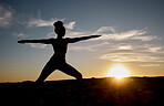 Silhouette, yoga and sunset with woman on rock for training, fitness and zen wellness. Spiritual, faith and health with pilates girl workout with warrior pose in nature for relax, peace and balance
