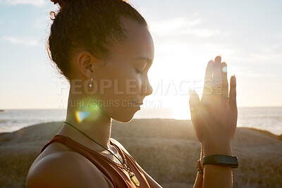 Buy stock photo Meditation, beach flare and yoga girl meditate for spiritual balance, healthcare wellness or chakra energy healing. Namaste, nature sunset and training black woman with peace, freedom and zen mindset