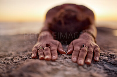 Buy stock photo Fitness, woman meditation or yoga hands on sand floor stretching at the beach, ocean or sea with sunset in background for wellness, exercise or zen. Girl, health for chakra focus, mindset or pilates