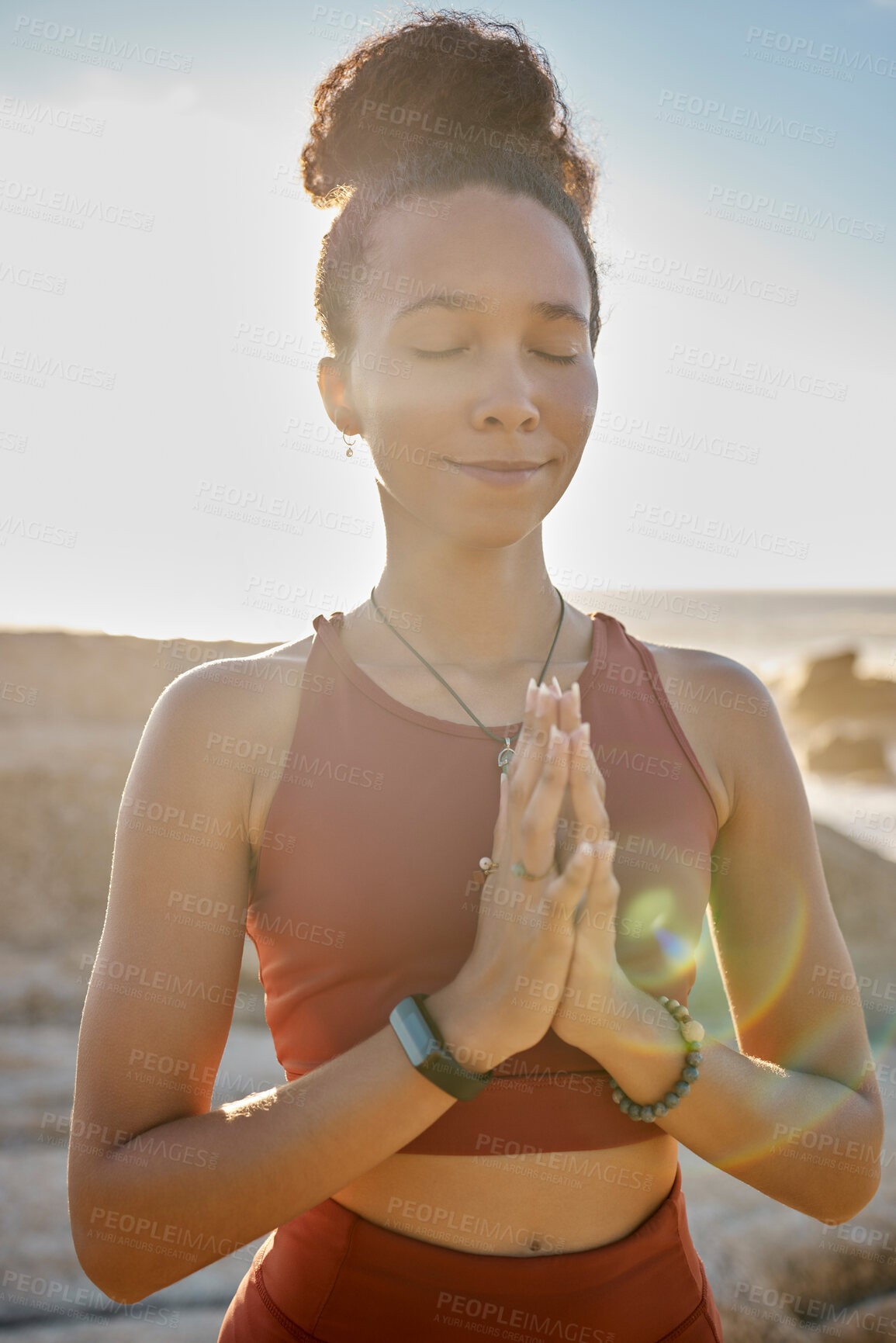 Buy stock photo Meditation, calm and woman doing exercise at the beach for wellness, peace and relaxation. Nature, fitness and black woman with hands together doing workout for zen, mental health and energy by ocean