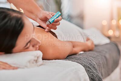 Buy stock photo Aromatherapy, relax and spa with a woman client on a massage bed for moxibustion treatment. Skincare, luxury and wellness with a female customer in a health center to relax for natural care