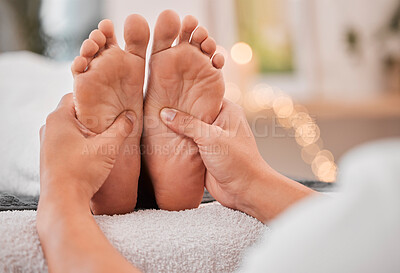 Buy stock photo Spa, feet and massage for relax, wellness and health on bed with hands, luxury and physical therapy. Professional, foot rub and service for healthcare, foot massage and healthy body care treatment