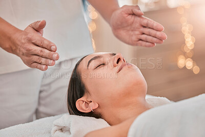 Spa, massage and reiki with head of woman for energy, chakra and spiritual therapy. Health, wellness and holistic healing with hands of therapist in salon for luxury, relax and alternative medicine