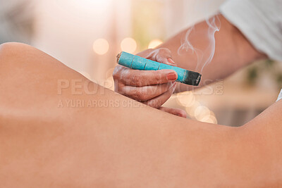 Spa, wellness and moxibustion treatment for body for health, traditional healing and stress relief. Physical therapy, alternative medicine and massage therapist using smoke in luxury beauty salon