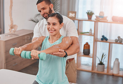 Buy stock photo Physiotherapy, exercise and dumbbells with a man therapist and woman client in a rehabilitation session. Fitness, health and consulting with a female patient in recovery training with a male physio