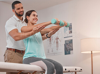 Buy stock photo Physical therapy, dumbbell and physiotherapist helping woman for muscle, fitness and body healthcare rehabilitation. Physiotherapy, patient and chiropractor support with stretching for sports injury