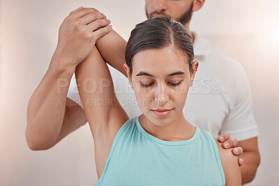 Physiotherapy, woman and stretching arm with coach for fitness healthcare or sports wellness. Rehabilitation recovery, personal trainer and orthopedic physical therapy or physiotherapist help patient