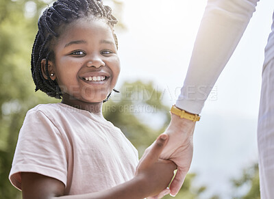Buy stock photo Portrait, adoption and family holding hands by mother and child, interracial, love and trust against a nature background. Foster child, hand and help from foster parent, happy and safety in Africa