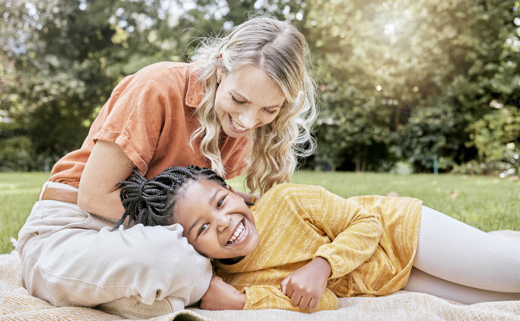 Buy stock photo Relax, mother and adoption child picnic with park blanket for bonding, happiness and wellness. Foster, trust and mama with black kid in South Africa with happy family smile together in nature.


