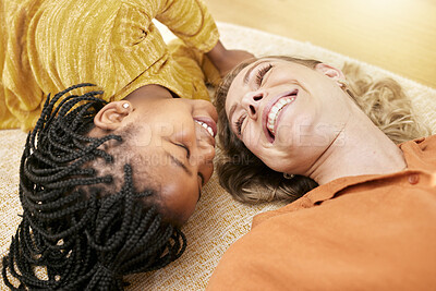 Buy stock photo Family, happiness and love after adoption of foster child while lying on the floor for love, care and trust with a smile. Face of a woman and black kid together as mother and daughter for support