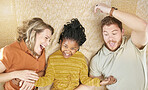 Happy, adoption and interracial family relaxing, playing and bonding together in their home. Happiness, love and multiracial parents with their girl child resting in the living room of a modern house