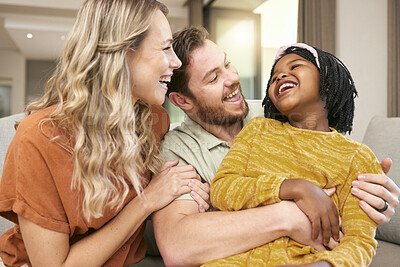 Buy stock photo Family, love and hug, laughing and happiness with care and funny, bonding and couple with black child together at family home. Happy family, adoption or foster care and interracial with relationship.