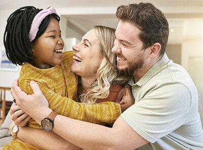 Buy stock photo Adoption, love and family hug in home, bonding and having fun. Support, care and father, mother and foster child or black girl hugging, embrace or cuddle and enjoying quality time together in house.
