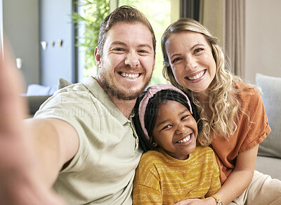 Buy stock photo Happy family, adoption and smile for selfie love, relax or bonding in happiness together at home. Mother, father and adopted child smiling or relaxing for photo moment or capture on living room couch