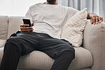 Social media, relax and man on the sofa with a phone for communication, internet and mobile app chat. Website, connection and person on the couch with a mobile, wifi and search of the web in his home