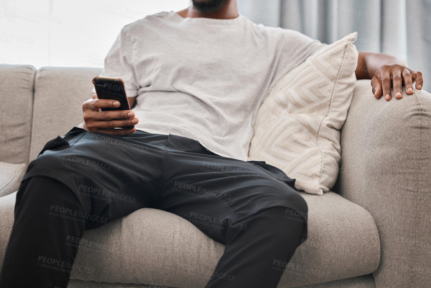 Buy stock photo Social media, relax and man on the sofa with a phone for communication, internet and mobile app chat. Website, connection and person on the couch with a mobile, wifi and search of the web in his home