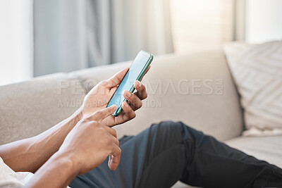 Buy stock photo Mobile phone, communication and 5g network, man on living room couch for social media app to chat or streaming video online. Hand of male on smartphone for networking, reading news or internet search