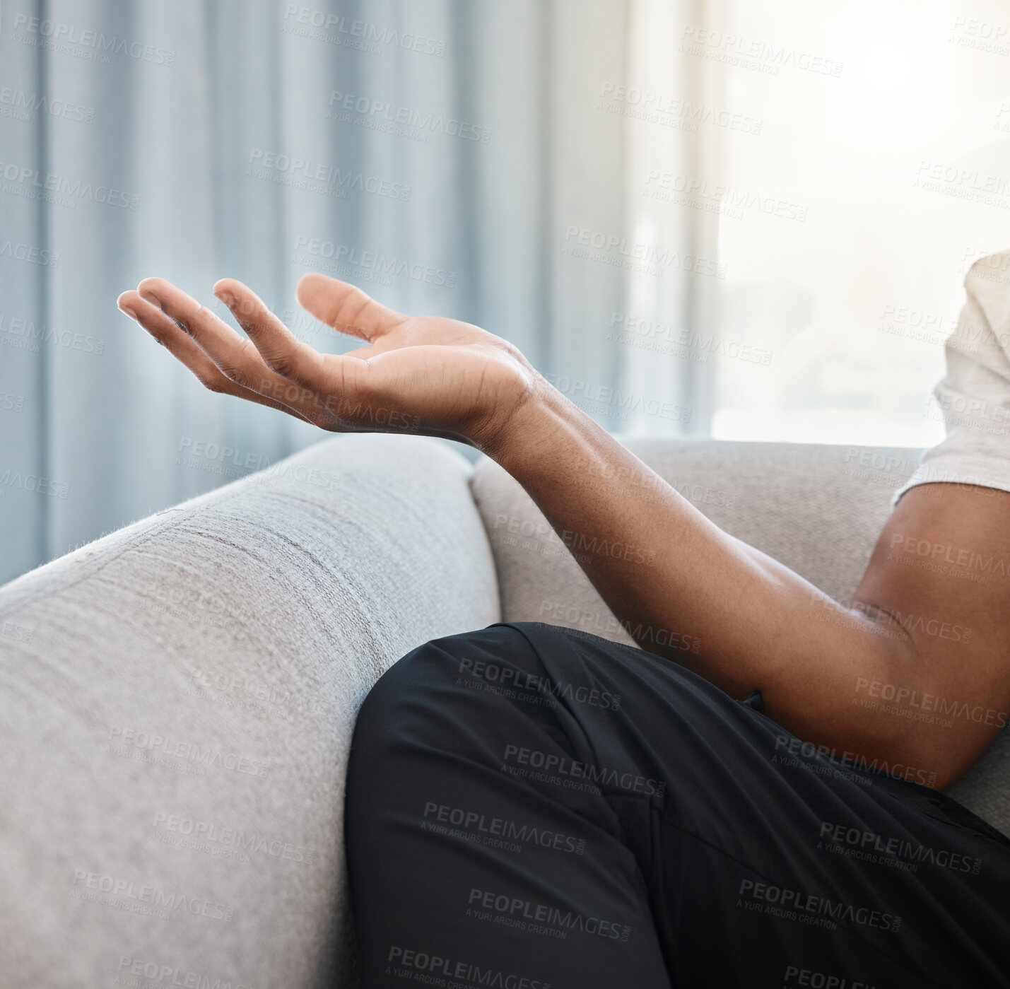 Buy stock photo Hand, yoga and meditation with a black man on the sofa, sitting in the living room of his home alone. Wellness, zen and meditate with male yogi in his house to relax for mental health or balance