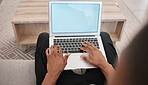 Hands, typing and laptop mockup screen of black man busy with work, social media or application. Internet, communication and wifi connection of person at home with advertising green screen.

