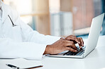 Doctor, hands and typing on laptop in office, working on research or online consultation. Healthcare, computer and black male physician writing patient report, data record or checking medical email.