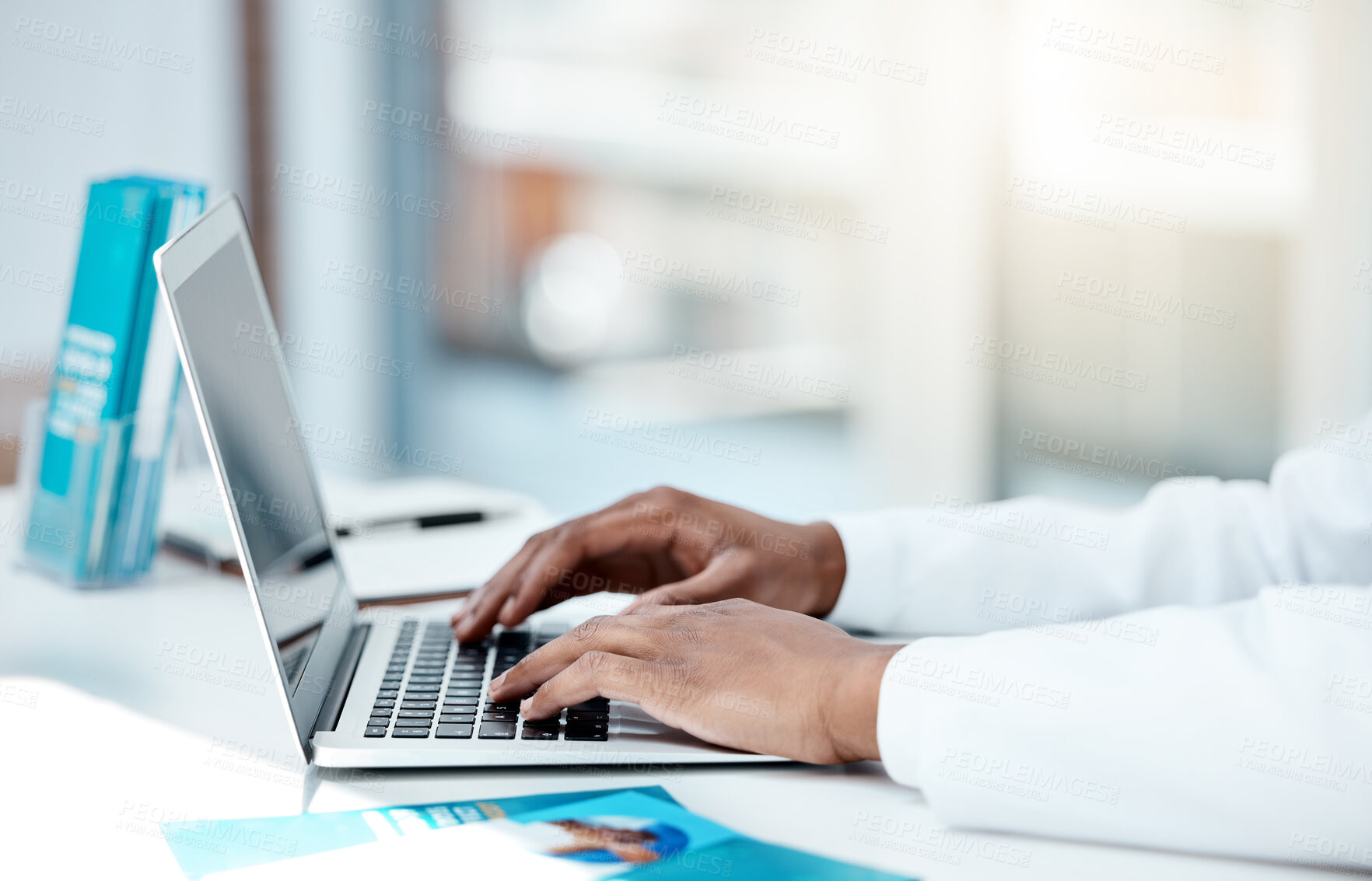 Buy stock photo Laptop, doctor and hands typing an email with medical research from hospital survey data results or feedback. Digital, keyboard and healthcare worker networking online after writing a science report