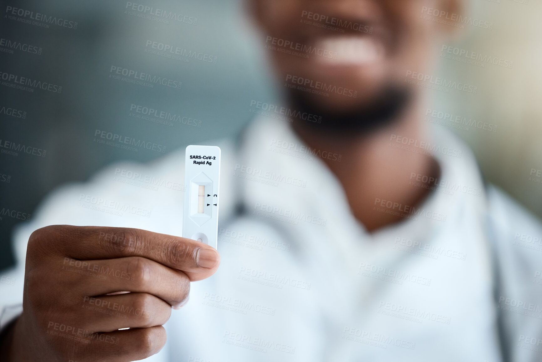 Buy stock photo Covid, hand and antigen rapid test with a black man showing his negative result after a medical exam. Health, wellness and insurance with a male holding up a reading on a corona virus testing kit