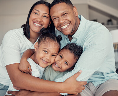 Buy stock photo Happy, smile and portrait of family hugging, bonding and relaxing together in their home. Loving, father and mother holding their children with love, care and happiness in the living room in a house.