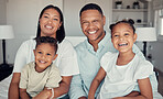 Family, relax and happy together in home for love, care and support portrait. Black family, smile and parents spend quality time with children on vacation or holiday in family home for happiness