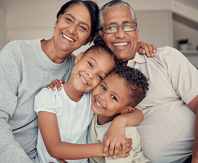 Buy stock photo Family portrait, happiness and love of children and grandparents with a smile, hug and support while together on a living room couch at home. Face, care and happy kids with a senior man and woman