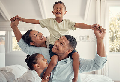 Buy stock photo Mother, father and kids, a happy family playing on bed in home, smile and laugh with piggy back on holiday weekend. Love, fun and family time for dad, mom and children in family bedroom in Brazil.