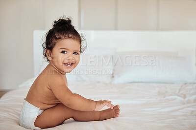 Buy stock photo Happy, health and baby on bed portrait in diaper with wellness, cheerful and cute smile in home. Relax, happiness and healthy toddler in disposable napkin and barefoot in house bedroom.
