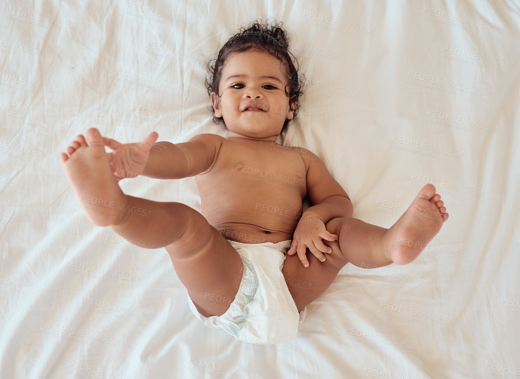 Buy stock photo Happy, smile and portrait of a baby with a diaper relaxing on a bed in his bedroom or nursery. Happiness, health and toddler kid by with a disposable nappy laying and relaxing in room at family home.