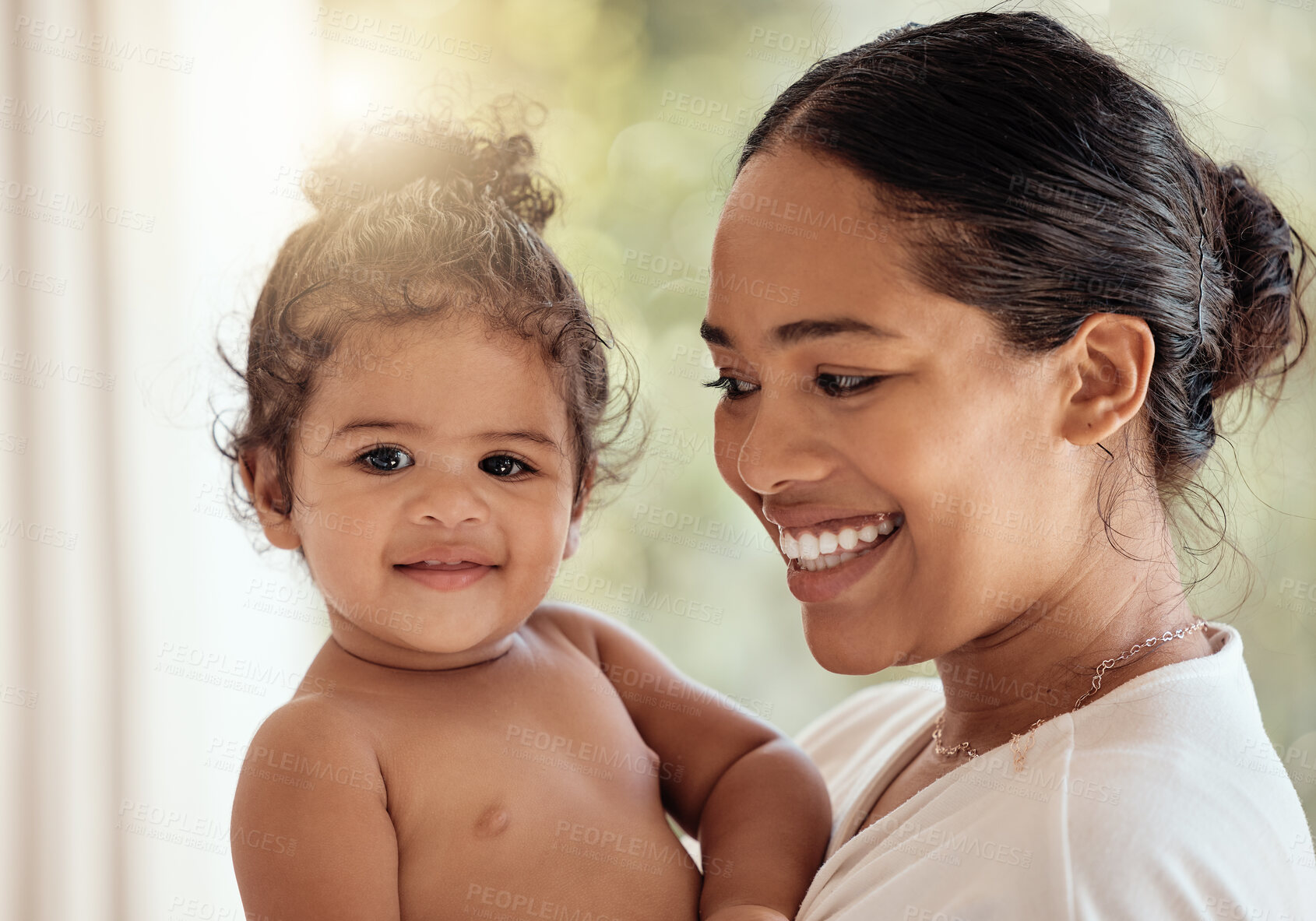 Buy stock photo Mother, baby and happiness of family with a smile, love and care while together in house for quality time and bonding. Face of a woman and child together for security and safety with lens flare 