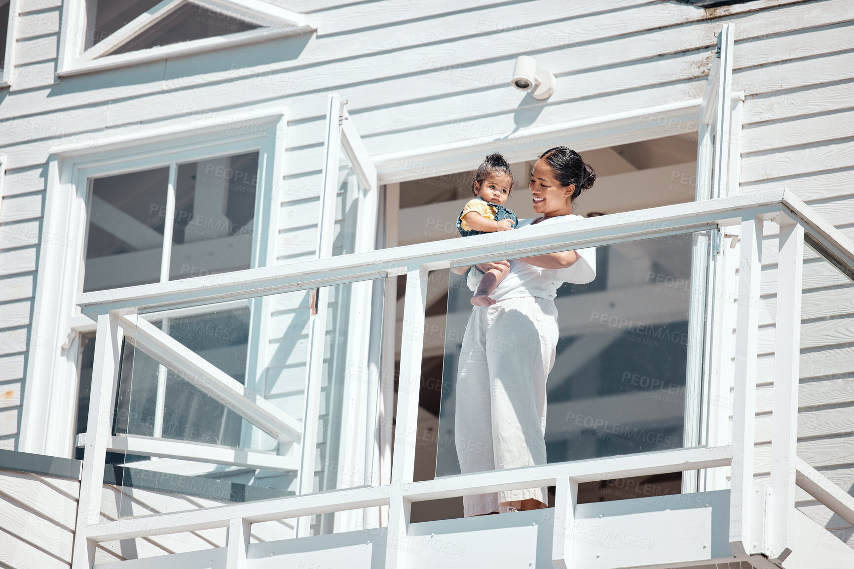 Buy stock photo Balcony, holiday and family or mother with baby for summer, wealth and real estate happiness, investment or house outdoor. Happy, care and mom with child together for vacation home, villa or property