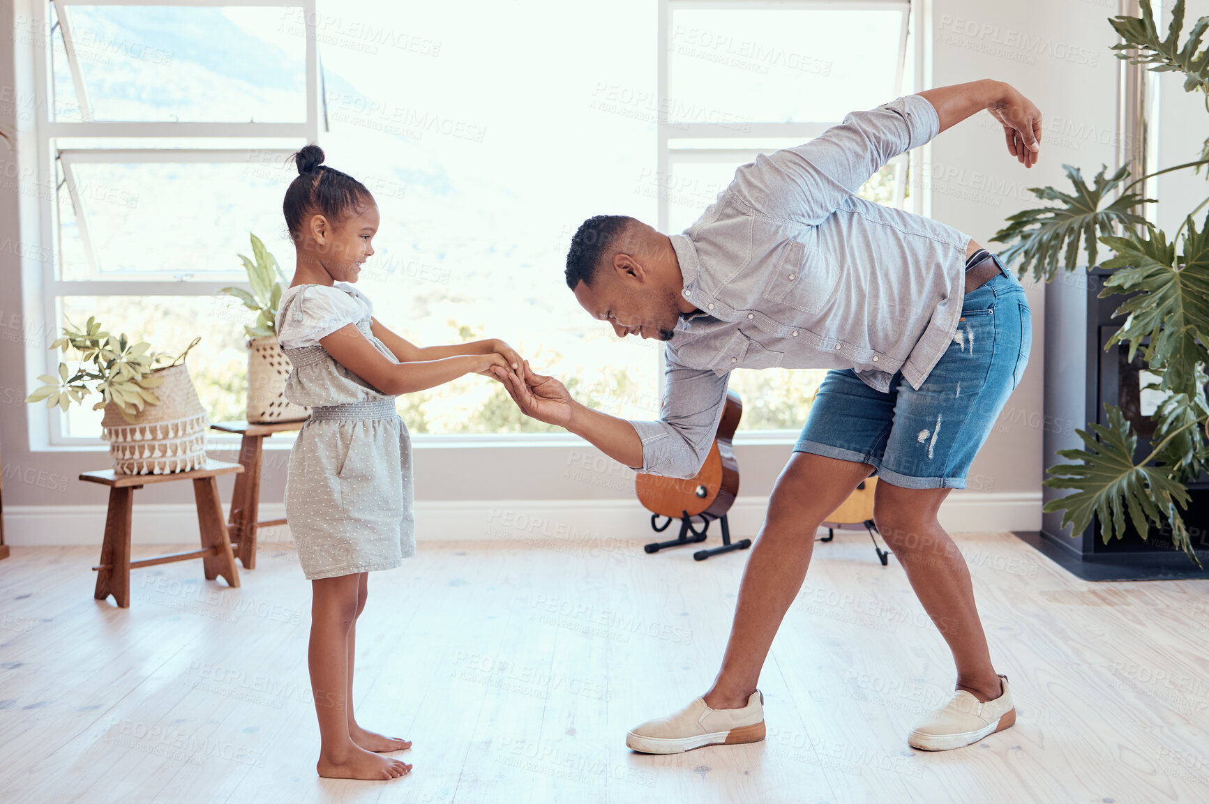 Buy stock photo Happy family, dance and dad and child holding hands, bond and enjoy fun quality time together for Fathers Day. Love, happiness and black man bow to girl while dancing, playing and teaching youth kid