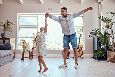 Buy stock photo Father, daughter and dancing in living room family home with energy, freedom and fun, relax and happy lifestyle together. Dad, girl kid and happy family spinning dance to music, bonding and happiness