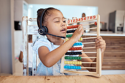 Buy stock photo Education, house and child learning math with a colorful child development toy for numbers counting. Headphones, mathematics or creative young kindergarten student home schooling busy with assessment