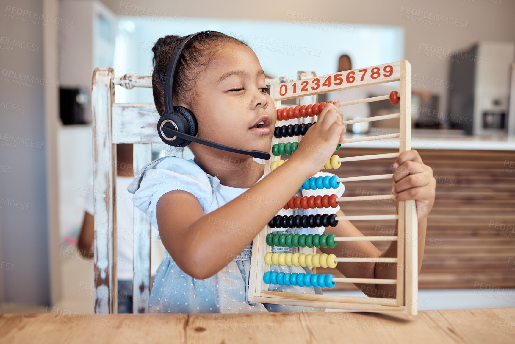 Buy stock photo Education, house and child learning math with a colorful child development toy for numbers counting. Headphones, mathematics or creative young kindergarten student home schooling busy with assessment