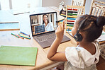 Video call, online education and child with teacher for math, numbers and school teaching, learning and listening with headphones. Girl kid on laptop screen zoom call for a virtual class test at home