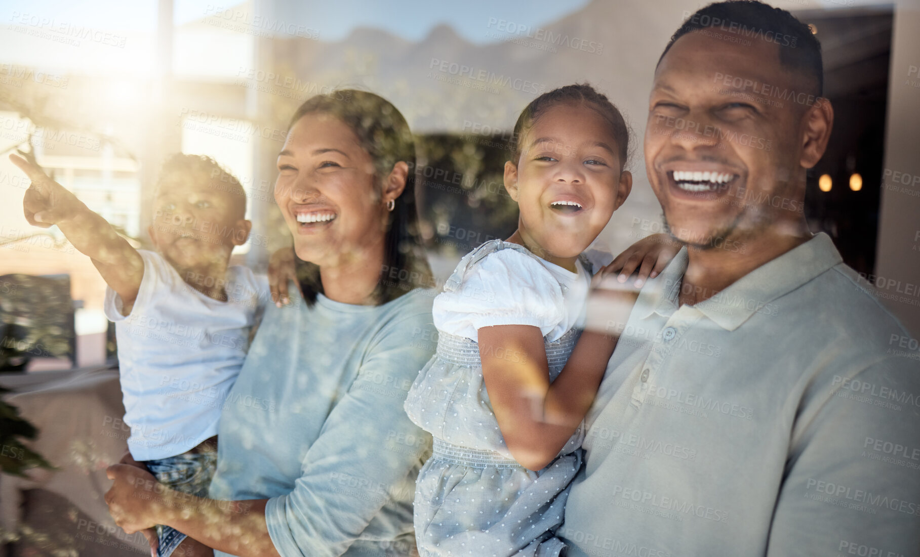 Buy stock photo Love, home window and happy family pointing at view while laughing, bonding or enjoy relax quality time. Glass reflection, sun flare and black family care of child, mother and father excited together