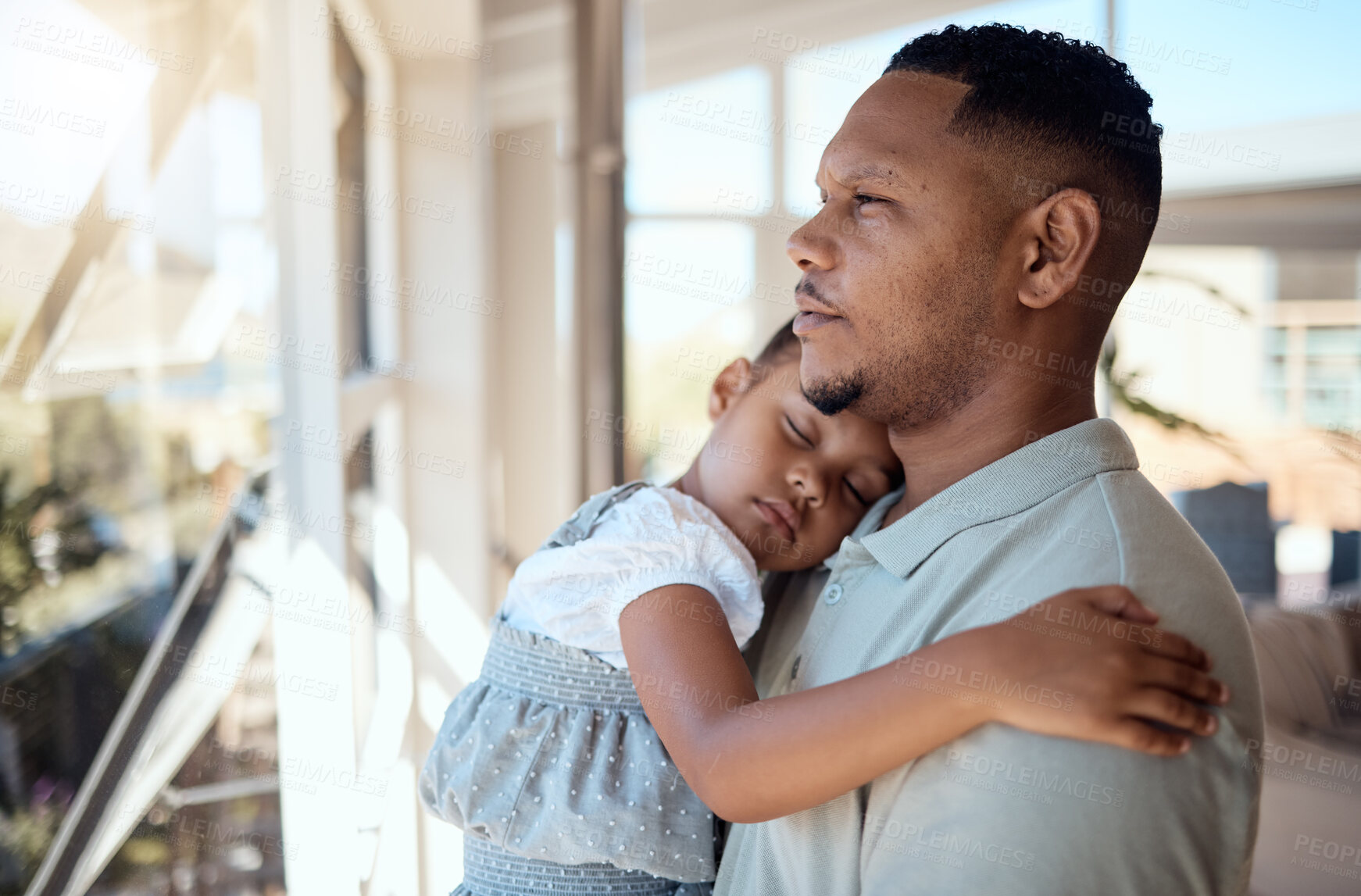 Family, home and father with sleeping girl in arms, standing and looking  out window. Love, child care and dad carrying tired, exhausted and young  daughter with affection, bonding and enjoying weekend |