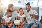 Parents, kids and happy family watching tv, movie and media, tv show and cartoon film in home lounge, living room sofa and house. Happy family relax with popcorn, television streaming and multimedia 
