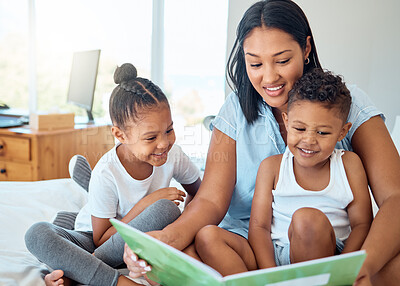 Buy stock photo Mother reading a book to her children in a bedroom to relax, bond and learn in their family home. Happiness, education and woman doing storytelling with her kids while relaxing on a bed in a house.